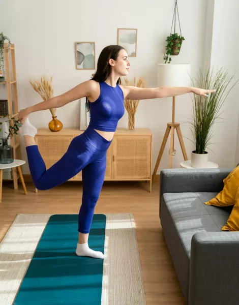 Young woman doing yoga at home. Young woman doing yoga at home.